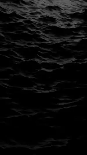 •  Black iPhone on alloy casing and black background.