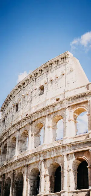 Majestic Colosseum Under Clear Blue Sky