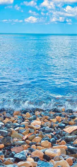 a beach with rocks and water